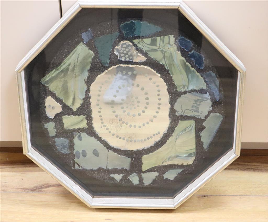 An octagonal mirrored glass panel by Humphrey Spender